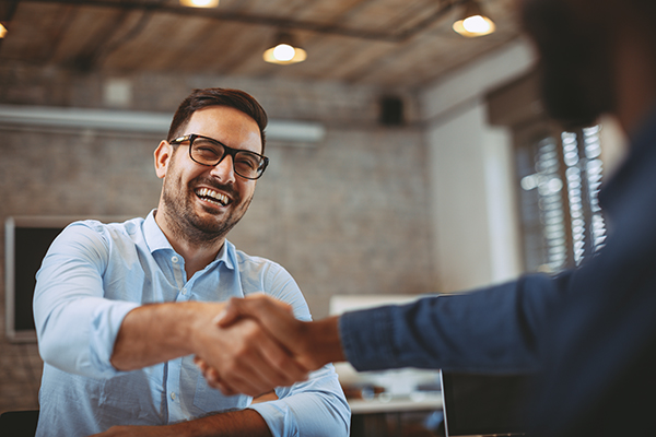 Two men shaking hands.