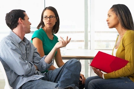 Schools nurse and parents sitting and discussing
